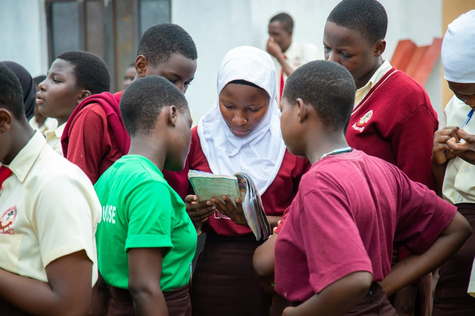 Students gathered around health learning materials